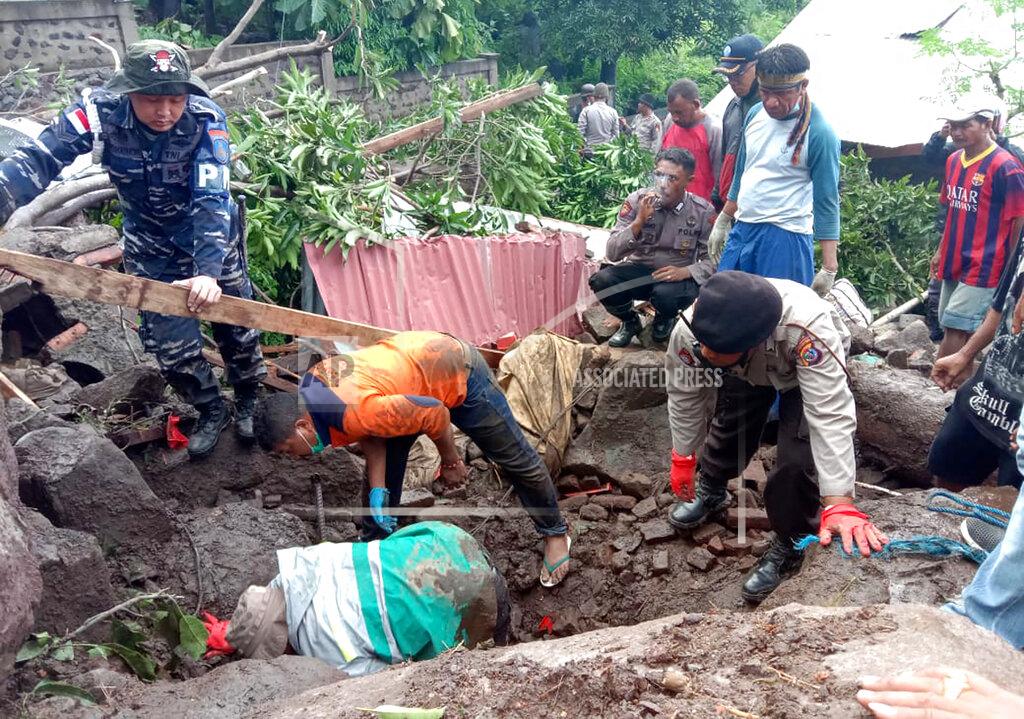 Ricko Wawo Rescuers search for victims at a village hit by a landslide in Ile Ape Timur on Lembata Island, East Nusa Tenggara province, Indonesia, Monday, April 5, 2021. Multiple disasters caused by torrential rains in eastern Indonesia and neighboring East Timor have left a number of people dead or missing as rescuers were hampered by damaged bridges and roads and a lack of heavy equipment Monday. (AP Photo/Ricko Wawo)