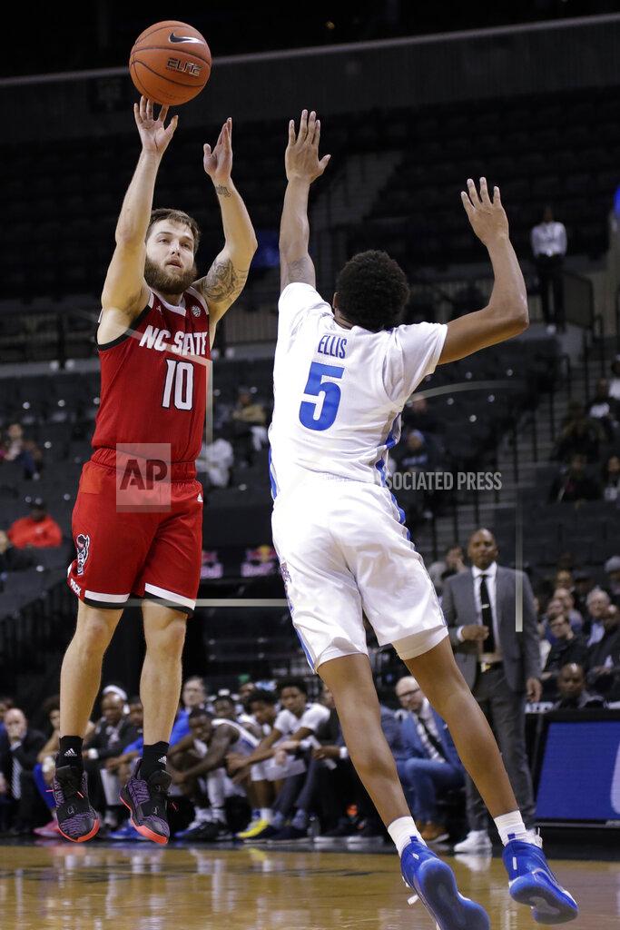Frank Franklin Ii North Carolina State's Braxton Beverly (10) shoots over Memphis' Boogie Ellis (5) during the second half of an NCAA college basketball game in the Barclays Classic, Thursday, Nov. 28, 2019, in New York. Memphis won 83-78. (AP Photo/Frank Franklin II)