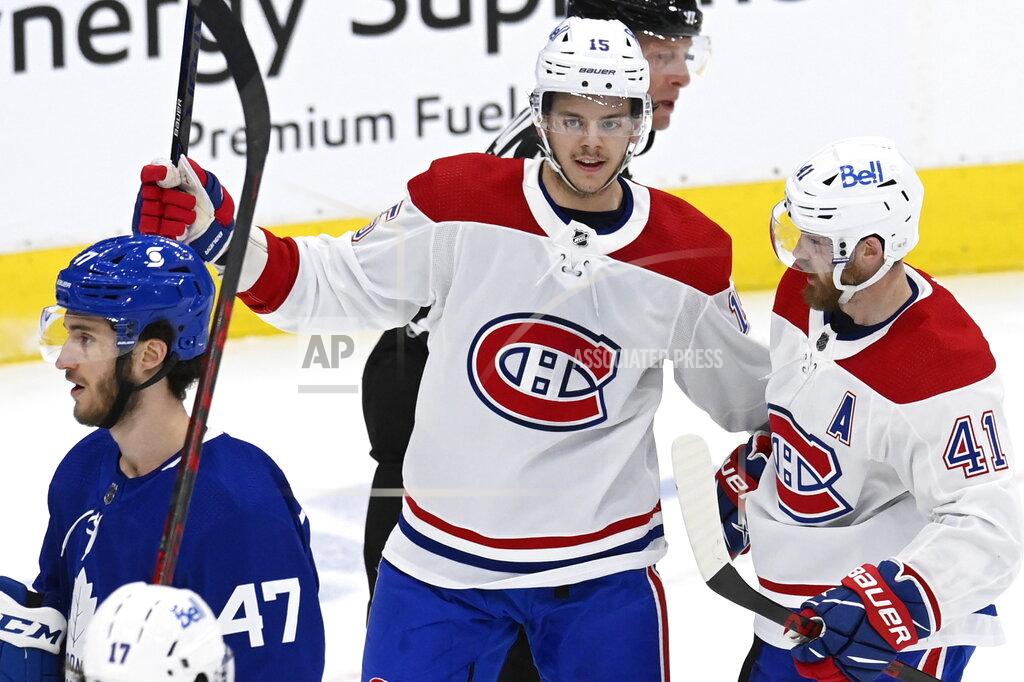 Frank Gunn Montreal Canadiens center Jesperi Kotkaniemi (15) celebrates his goal against the Toronto Maple Leafs with Paul Byron (41) during the second period in Game 5 of an NHL hockey Stanley Cup first-round playoff series in Toronto on Thursday, May 27, 2021. (Frank Gunn/The Canadian Press via AP)