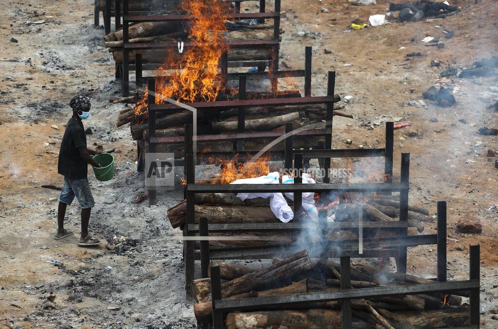 Aijaz Rahi Bodies of people who died of COVID-19 are cremated at an open crematorium on the outskirts of Bengaluru, Karnataka state, India, Wednesday, May 12, 2021. (AP Photo/Aijaz Rahi)