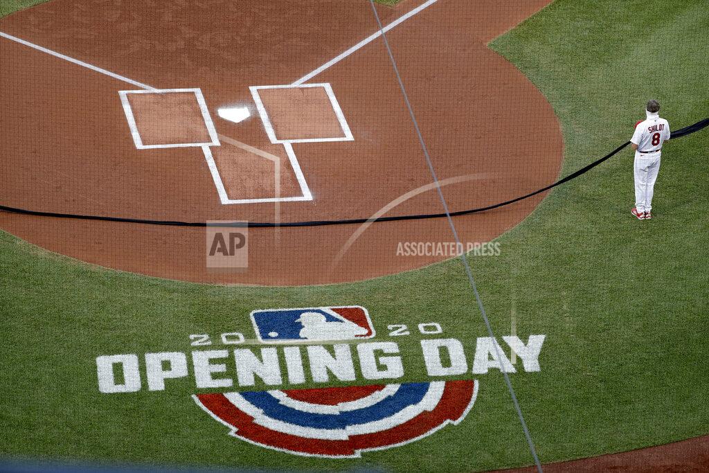Jeff Roberson St. Louis Cardinals manager Mike Shildt holds a black ribbon as part of a Black Lives Matter ceremony before the start of a baseball game against the Pittsburgh Pirates on opening day for the two teams Friday, July 24, 2020, in St. Louis. (AP Photo/Jeff Roberson)