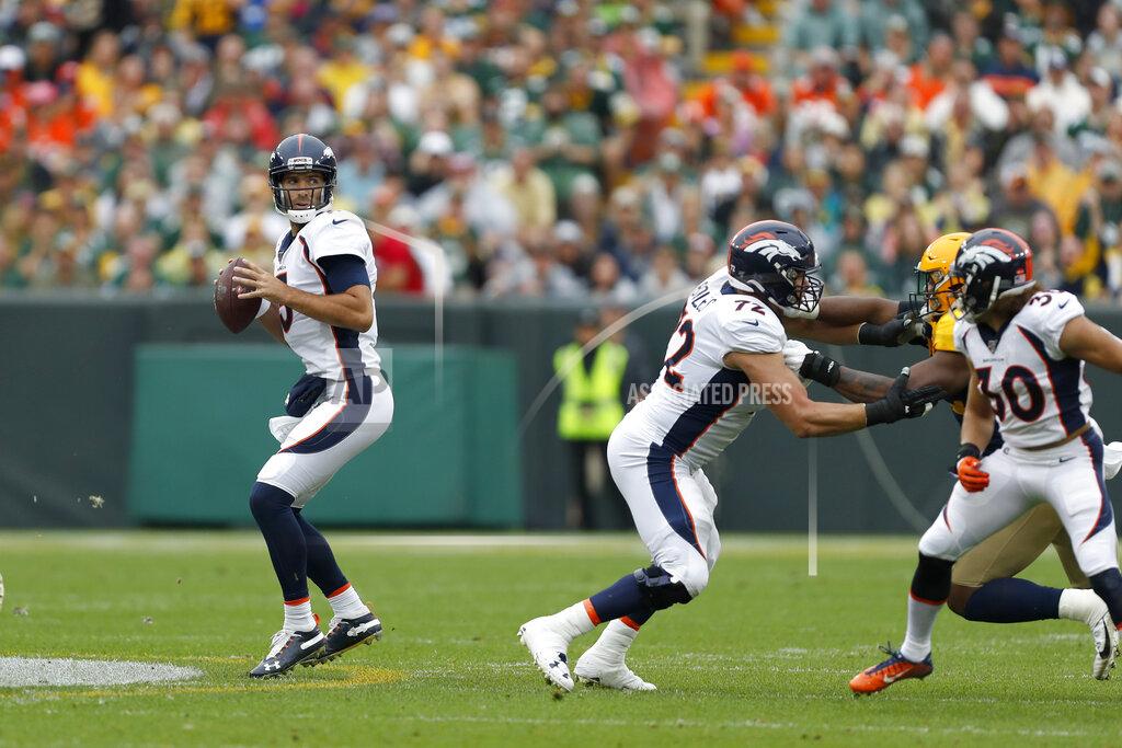 Matt Ludtke Denver Broncos quarterback Joe Flacco, left, drops back to pass during the first half of an NFL football game against the Green Bay Packers, Sunday, Sept. 22, 2019, in Green Bay, Wis. (AP Photo/Matt Ludtke)
