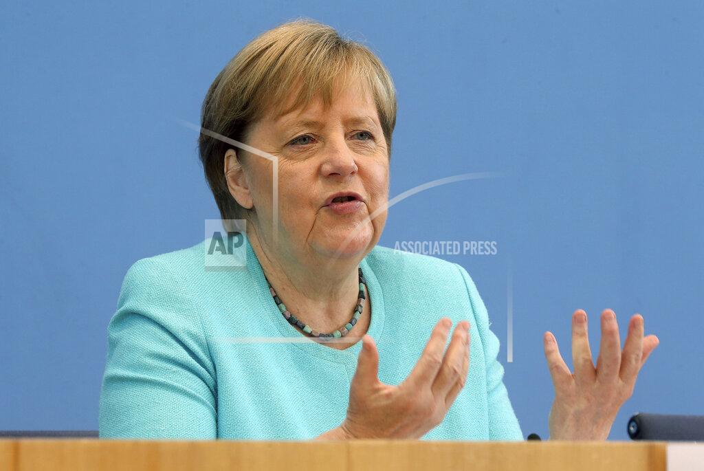 Wolfgang Kumm German Chancellor Angela Merkel, gestures, as she holds her annual summer news conference in Berlin, Germany, Thursday, July 22, 2021. Merkel said Thursday that new coronavirus infections in Germany are once again rising at worrying speed. She appealed to her compatriots to get vaccinated and persuade others to do so. (Wolfgang Kumm/dpa via AP)
