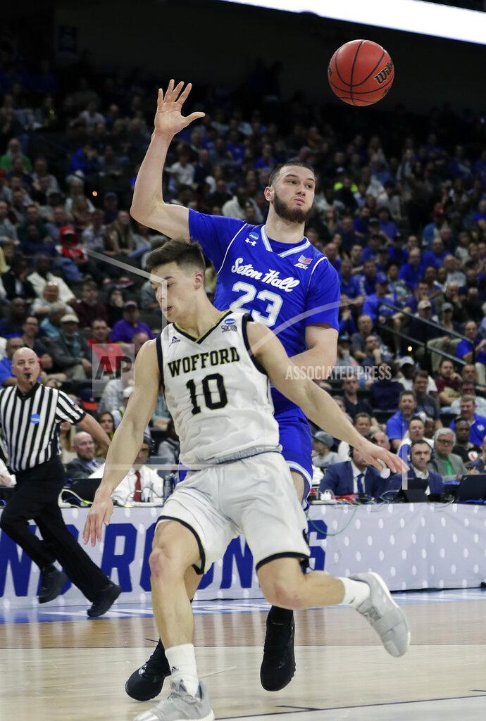 John Raoux Seton Hall's Sandro Mamukelashvili (23) passes the ball over Wofford's Nathan Hoover (10) during the first half of a first-round game in the NCAA men’s college basketball tournament in Jacksonville, Fla., Thursday, March 21, 2019. (AP Photo/John Raoux)
