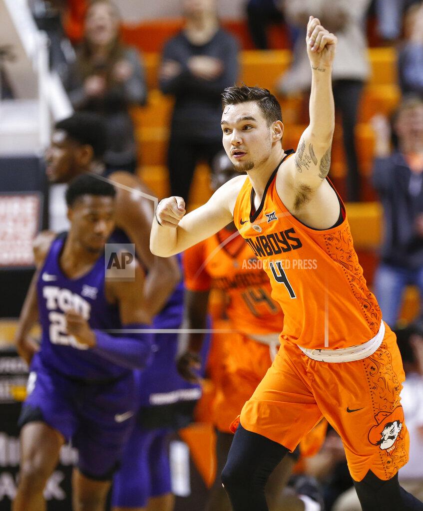 Nate Billings Oklahoma State's Thomas Dziagwa (4) celebrates after making a three-point shot in the second half of a NCAA college basketball game against TCU in Stillwater, Okla., Monday, Feb. 18, 2019. (Nate Billings/The Oklahoman via AP)