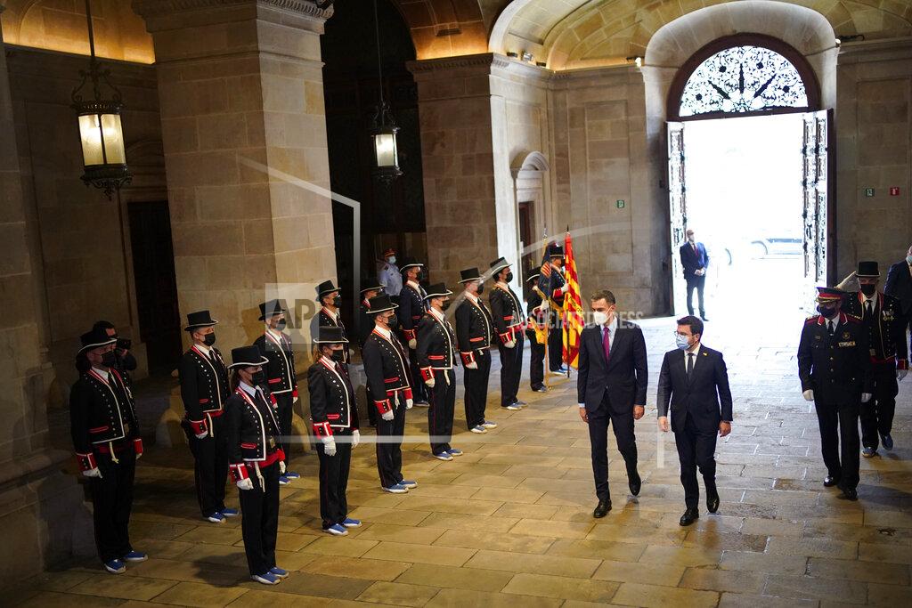 Joan Mateu Parra Spanish Prime Minister Pedro Sanchez and Catalonian regional president Pere Aragonès, right, arrive at the headquarter of the Government of Catalonia in Barcelona, Spain, Wednesday, Sept. 15, 2021. Spain's prime minister and the leader of Catalonia are restarting negotiations in hopes of finding a solution to the ongoing political crisis caused by the region's separatist movement. (AP Photo/Joan Mateu Parra)