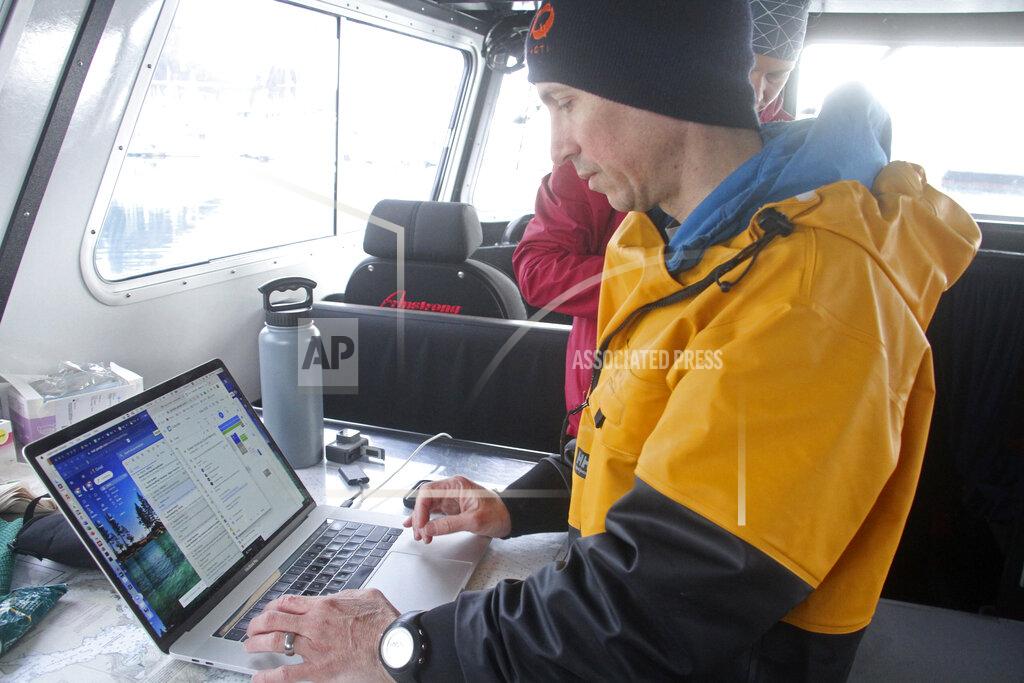 Mark Thiessen This May 4, 2022, photo shows University of Alaska Fairbanks oceanographer Andrew McDonnell checking data on his computer aboard the University of Alaska Fairbanks research vessel Nanuq in the Gulf of Alaska. The data was from a special sensor which was fitted to an underwater glider to study ocean acidification. (AP Photo/Mark Thiessen)
