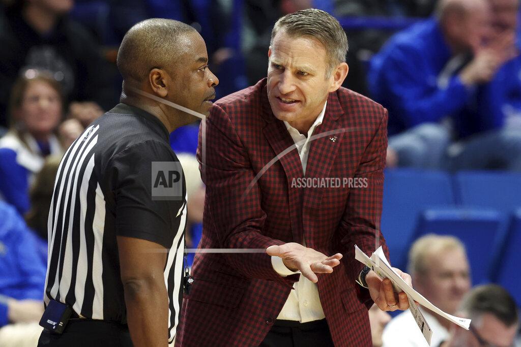James Crisp Alabama head coach Nate Oats, right, makes a point with referee Pat Adams during the second half of an NCAA college basketball game against Kentucky in Lexington, Ky., Saturday, Feb. 19, 2022. Kentucky won 90-81. (AP Photo/James Crisp)