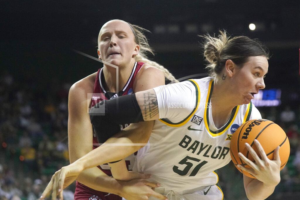 Lm Otero Baylor forward Caitlin Bickle (51) and South Dakota center Hannah Sjerven fight for a rebound during the first half of a college basketball game in the second round of the NCAA tournament in Waco, Texas, Sunday, March 20, 2022. (AP Photo/LM Otero)