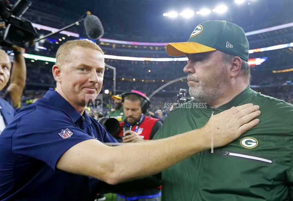 FILE - In this Jan. 15, 2017, file photo, Dallas Cowboys coach Jason Garrett, left, congratulates Green Bay Packers coach Mike McCarthy after their 34-31 win in an NFL divisional playoff football game in Arlington, Texas. The Dallas Cowboys didn't take long to settle on Mike McCarthy as their coach after waiting a week to announce they were moving on from Jason Garrett. McCarthy, who won a Super Bowl at the home of the Cowboys nine years ago as Green Bay's coach, has agreed to become the ninth coach in team history, a person with direct knowledge of the deal said Monday, Jan. 6, 2020.The person spoke to The Associated Press on condition of anonymity because the team hasn't announced the move. (AP Photo/Tony Gutierrez, File)