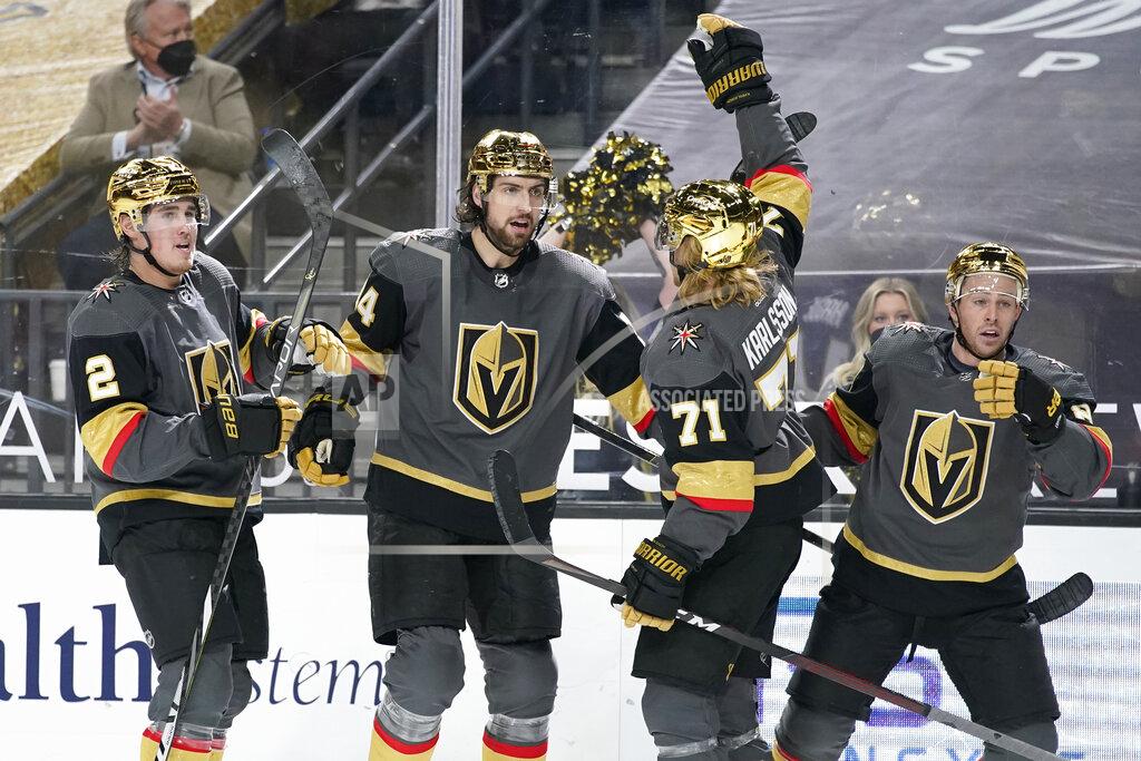 John Locher Vegas Golden Knights celebrate after defenseman Nicolas Hague, second from left, scored against the Los Angeles Kings during the second period of an NHL hockey game Monday, March 29, 2021, in Las Vegas. (AP Photo/John Locher)