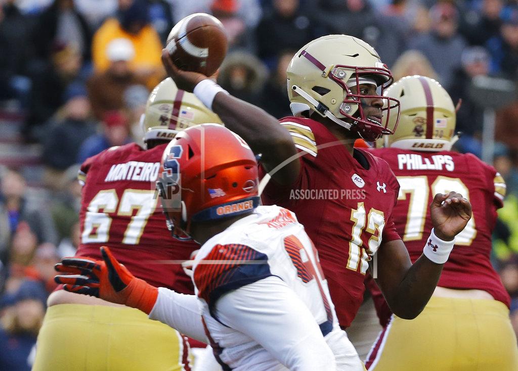 Mary Schwalm Boston College quarterback Anthony Brown (13) passes under pressure during the second half of an NCAA college football game against Syracuse, Saturday, Nov. 24, 2018, in Boston. (AP Photo/Mary Schwalm)