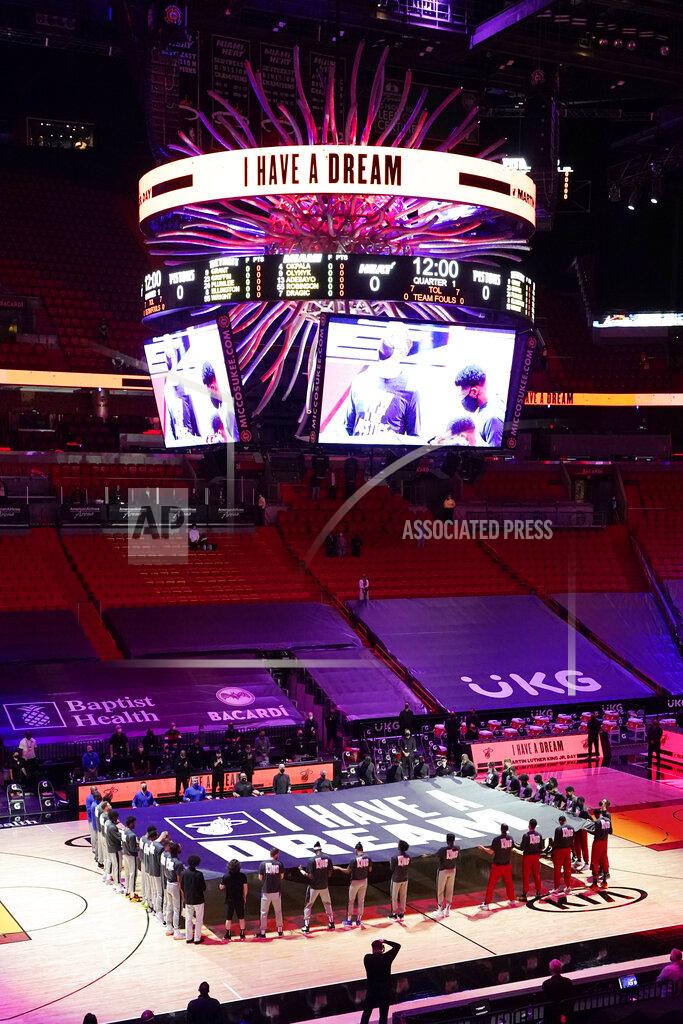 Marta Lavandier Miami Heat and Detroit Pistons players hold a "I Have a Dream" banner in honor of the Martin Luther King Jr., holiday before an NBA basketball game, Monday, Jan. 18, 2021, in Miami. (AP Photo/Marta Lavandier)