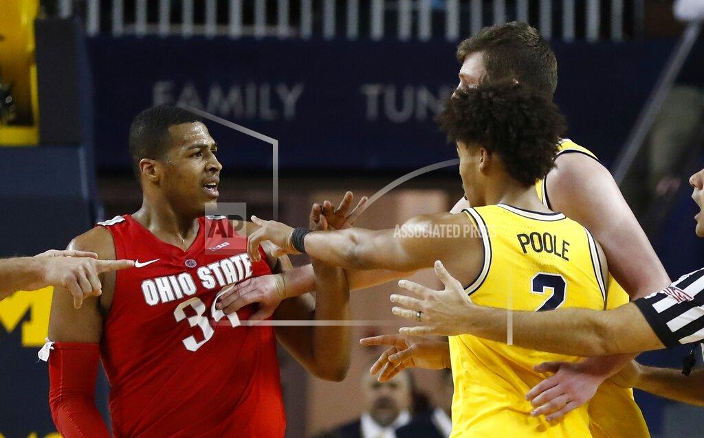 Carlos Osorio Michigan center Jon Teske pushes away Ohio State forward Kale Wesson while guard Jordan Poole (2) gestures during the second half of an NCAA college basketball game Tuesday, Jan. 29, 2019, in Ann Arbor, Mich. (AP Photo/Carlos Osorio)