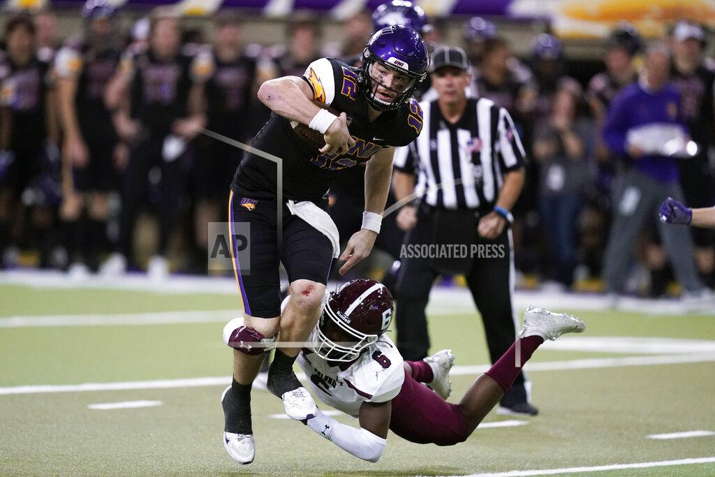 Charlie Neibergall Northern Iowa quarterback Theo Day (12) tries to break a tackle by Southern Illinois safety Jakari Patterson (6) during the second half of an NCAA college football game, Saturday, Oct. 30, 2021, in Cedar Falls, Iowa. Northern Iowa won 23-16. (AP Photo/Charlie Neibergall)