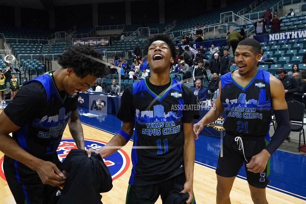 David J. Phillip Texas A&M Corpus Christi's Terrion Murdix (11), Ethan White (21) and Simeon Fryer (22) celebrate after the Southland Conference tournament NCAA college basketball game final against the Southeastern Louisiana Saturday, March 12, 2022, in Katy, Texas. Texas A&M Corpus Christi won 73-65.(AP Photo/David J. Phillip)
