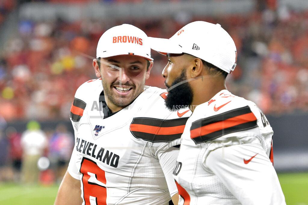 David Richard FILE - In this Aug. 8, 2019, file photo, Cleveland Browns' Baker Mayfield, left, smiles as he talks with wide receiver Odell Beckham Jr. during the second half of an NFL preseason football game against the Washington Redskins in Cleveland. Beckham believes the Browns offense will come around. Until then, he’s going to defend Mayfield. (AP Photo/David Richard, File)