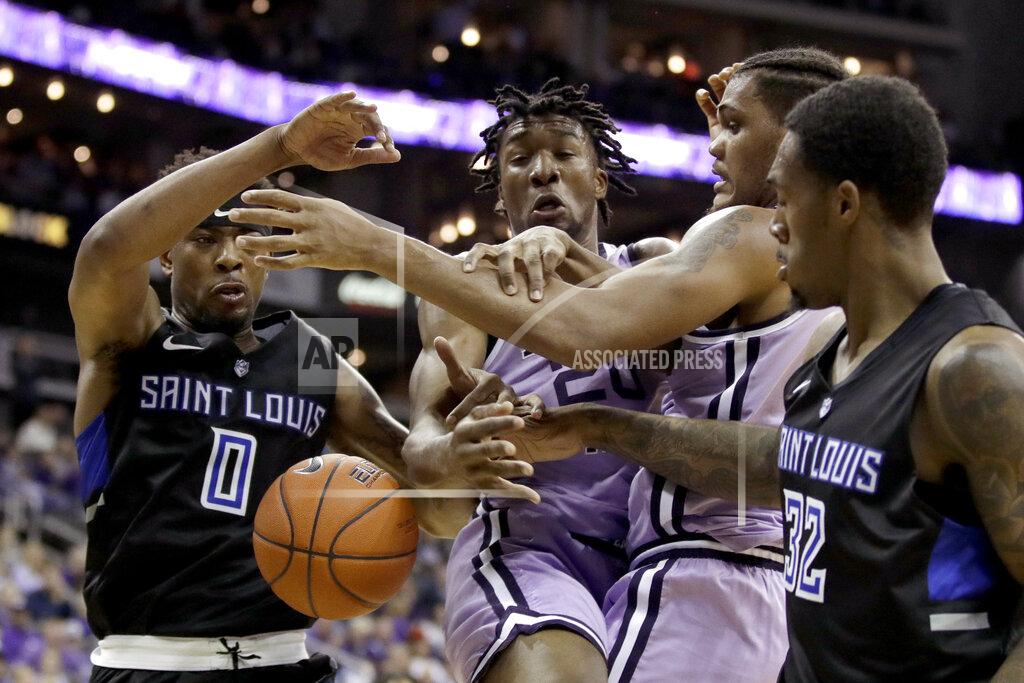 Charlie Riedel Saint Louis' Jordan Goodwin (0) and Jimmy Bell Jr. (32) battle with Kansas State's Xavier Sneed, center left, and Levi Stockard III, center right, for the ball during the second half of an NCAA college basketball game Saturday, Dec. 21, 2019, in Kansas City, Mo. (AP Photo/Charlie Riedel)