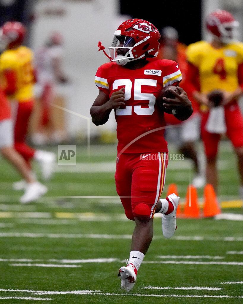 Charlie Riedel FILE - Kansas City Chiefs running back Clyde Edwards-Helaire runs the ball during NFL football training camp Wednesday, Aug. 3, 2022, in St. Joseph, Mo. Edwards-Helaire and Isiah Pacheco were drafted on opposite ends of the spectrum, one a first-round pick with high expectations and the other seventh-round selection chosen almost as an afterthought. Yet a third of the way through training camp, the two are in a heated race to be the starting running back of the Kansas City Chiefs. (AP Photo/Charlie Riedel, File)