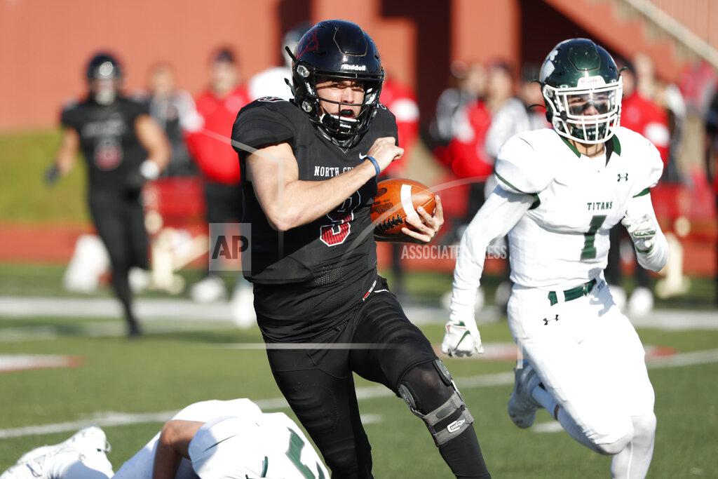 Steve Woltmann In this Nov. 9, 2019 photo, provided by North Central College Athletics, North Central quarterback Broc Rutter carries the ball against Illinois-Wesleyan during an NCAA college football game in Naperville, Ill. Rutter was selected to the Division III All-America first team on Thursday, Dec. 19, 2019. (Steve Woltmann/North Central College Athletics via AP)