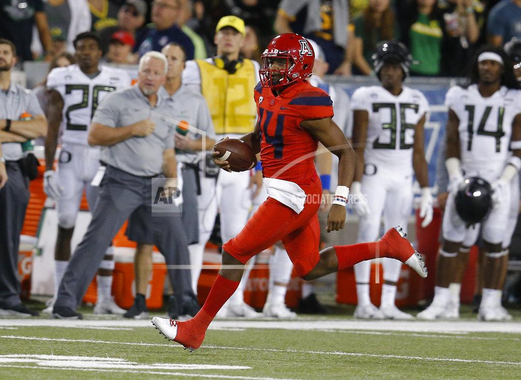 Rick Scuteri Arizona quarterback Khalil Tate (14) runs for a first down against Oregon in the second half during an NCAA college football game, Saturday, Oct. 27, 2018, in Tucson, Ariz. (AP Photo/Rick Scuteri)