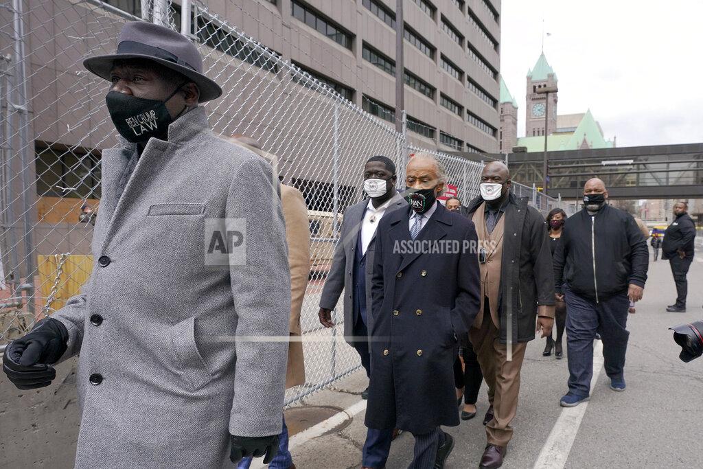 Julio Cortez FILE - In this Monday, April 19, 2021 file photo, Ben Crump, left, attorney representing George Floyd's family, walks with the Rev. Al Sharpton, center, and Floyd's brothers Terrence Floyd, center left, and Rodney Floyd, center right, outside of the Hennepin County Government Center in Minneapolis, before the murder trial against former Minneapolis police officer Derek Chauvin advances to jury deliberations. (AP Photo/Julio Cortez)