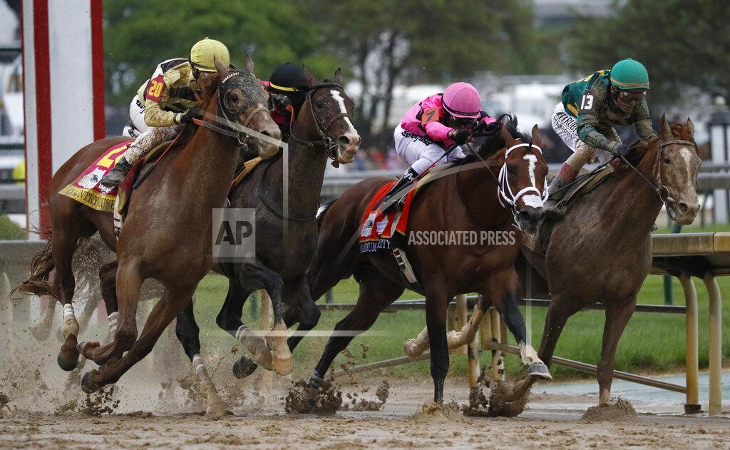 John Minchillo FILE - In this May 4, 2019, file photo, Flavien Prat on Country House, left, races against Luis Saez on Maximum Security, second from right, during the 145th running of the Kentucky Derby horse race at Churchill Downs in Louisville, Ky. Replay clearly shows the horse that finished first in the Kentucky Derby, Maximum Security, veering into the path of others. A 22-minute "inquiry" into the matter resulted in Maximum Security's disqualification. Horse racing, the sport that practically invented the use of instant replay to adjudicate results on the track (the photo finish dates back to the 1930s), had been bitten by the technology it helped create. (AP Photo/John Minchillo, File)