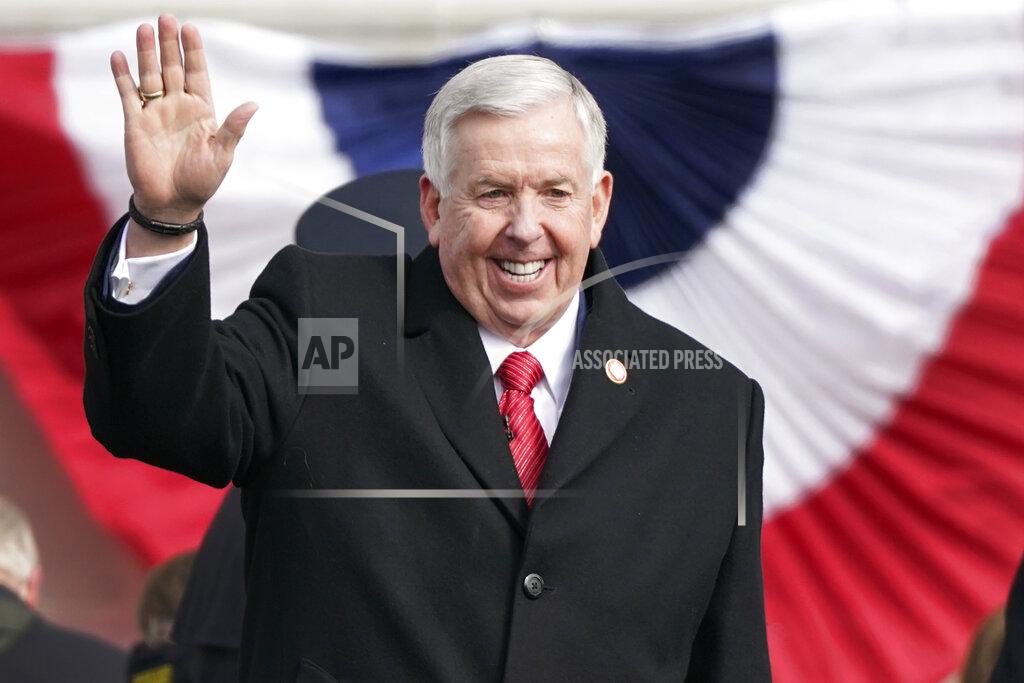 Missouri Gov. Mike Parson waves to supporters after being sworn in to his first full term as governor Monday, Jan. 11, 2021, in Jefferson City, Mo. (AP Photo/Jeff Roberson)