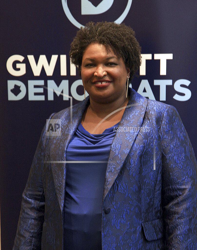 Akili-Casundria Ramsess Stacey Abrams attends the Gwinnett County Democratic Party fundraiser on Saturday, May 21, 2022, in Norcross, Ga. (AP Photo/Akili-Casundria Ramsess)