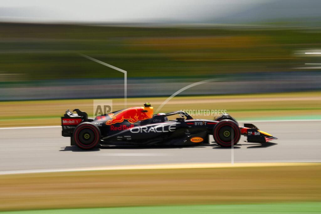 Manu Fernandez Red Bull driver Sergio Perez of Mexico steers his car during the third practice session at the Barcelona Catalunya racetrack in Montmelo, Spain, Saturday, May 21, 2022. The Formula One race will be held on Sunday. (AP Photo/Manu Fernandez)