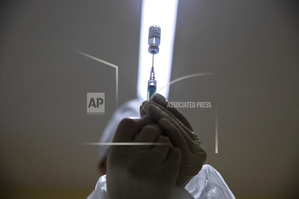 Pavel Golovkin FILE - In this Wednesday, Dec. 30, 2020 file photo, a medical worker prepares a shot of Russia's Sputnik V coronavirus vaccine in Moscow, Russia. Russian scientists say the country's Sputnik V vaccine appears safe and effective against COVID-19, according to early results of an advanced study published on Tuesday Feb. 2, 2021, in a British medical journal. (AP Photo/Pavel Golovkin, File)