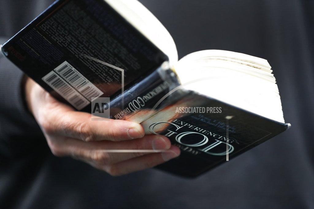 Paul Sancya Eastern Michigan football coach Chris Creighton reads from his devotional journal "Experiencing God Day-By-Day" in Ypsilanti, Mich., Monday, Dec. 10, 2018. The Eagles will face Georgia Southern in the Camellia Bowl on Saturday, earning a spot in postseason play for the second time in three years and just the third time in school history. (AP Photo/Paul Sancya)