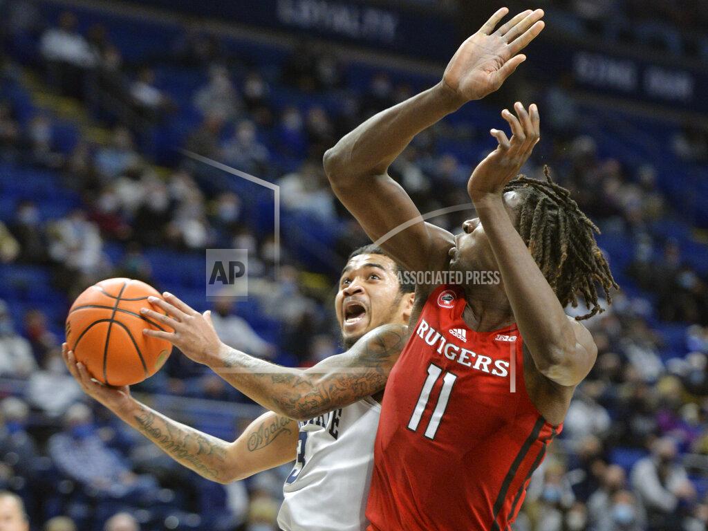 Gary M. Baranec Penn State's Sam Sessoms (3) drives to the basket on Rutgers Clifford Omoruyi (11) in the first half of an NCAA college basketball game Tuesday, Jan 11, 2022, in State College, Pa. (AP Photo/Gary M. Baranec)