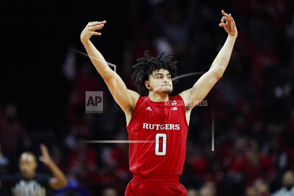 Kathy Willens Rutgers guard Geo Baker (0) celebrates after hitting a three-point shot during the first half of an NCAA college basketball game against Seton Hall, Saturday, Dec. 14, 2019, in Piscataway, N.J. (AP Photo/Kathy Willens)