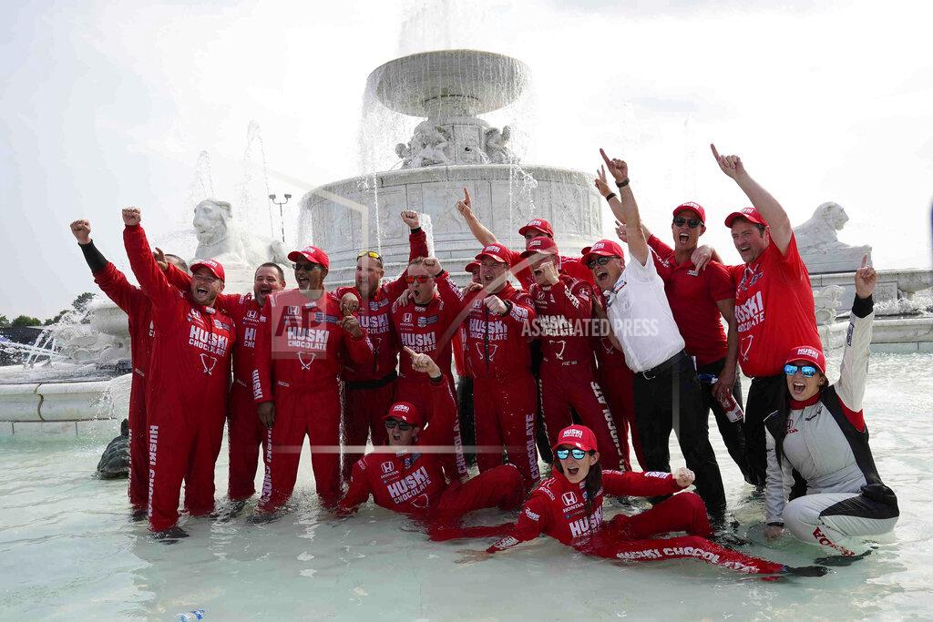 Paul Sancya Chip Ganassi engineer Angela Ashmore is shown sitting in the water, second from bottom right, next to Nicole Rotondo, an engineer with Honda Performance Development, bottom far right, as the team celebrates in a fountain after Marcus Ericsson of Sweden won the first race of the IndyCar Detroit Grand Prix auto racing doubleheader on Belle Isle in Detroit on Saturday, June 12, 2021. The last three IndyCar races have been won by drivers who have female engineers on their teams, a trend that could continue Sunday at Mid-Ohio Sports Car Course. (AP Photo/Paul Sancya)