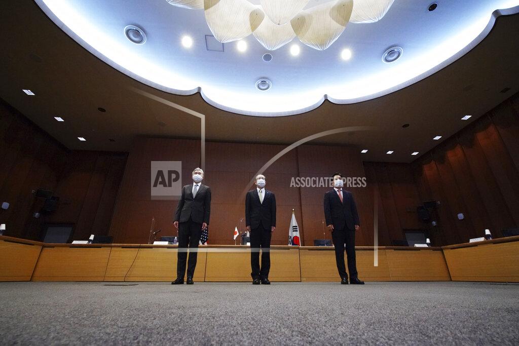 Eugene Hoshiko Japanese Foreign Ministry's Director-General of the Asian and Oceanian Affairs Bureau Takehiro Funakoshi, center, U.S. Special Representative for North Korea, Sung Kim, left, and South Korea's Special Representative for Korean Peninsula Peace and Security Affairs Noh Kyu-duk pose for photographers during their trilateral meeting on North Korea at Foreign Ministry Tuesday, Sept. 14, 2021 n Tokyo. (AP Photo/Eugene Hoshiko)
