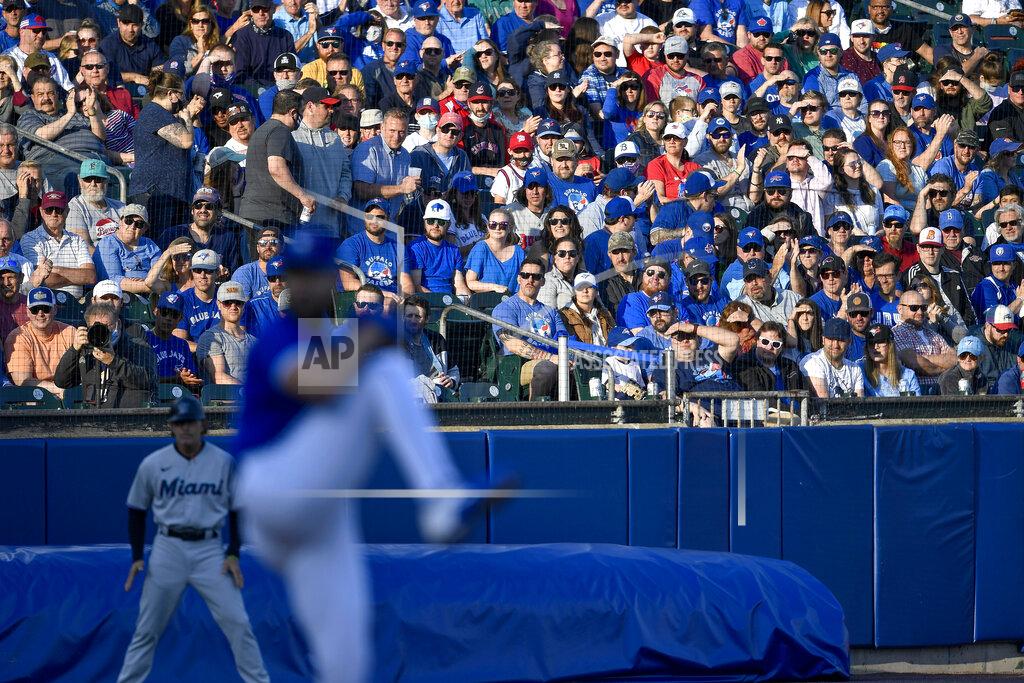 Adrian Kraus Fans watch Toronto Blue Jays starting pitcher Robbie Ray during the first inning of the team's baseball game against the Miami Marlins in Buffalo, N.Y., Tuesday, June 1, 2021. (AP Photo/Adrian Kraus)