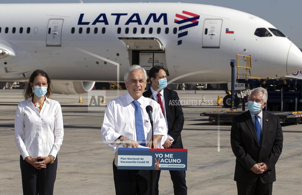 Esteban Felix FILE - In this Thursday, Jan. 28, 2021 file photo, President Sebastian Pinera speaks in front of the plane carrying the country's first batch of the CoronaVac vaccine for COVID-19 developed by Chinese biopharmaceutical company Sinovac Biotech, at Arturo Merino airport in Santiago, Chile. “Today,” he said, “is a day of joy, emotion and hope.” (AP Photo/Esteban Felix)