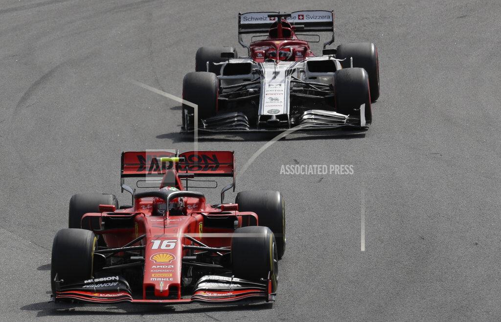 Silvia Izquierdo Ferrari driver Charles Leclerc, of Monaco, steers his car followed by Alfa Romeo driver Kimi Raikkonen, of Finland, during the Brazilian Formula One Grand Prix at the Interlagos race track in Sao Paulo, Brazil, Sunday, Nov. 17, 2019. (AP Photo/Silvia Izquierdo)