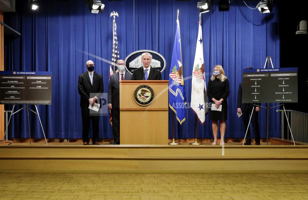 Yuri Gripas Deputy Attorney General Jeffrey A. Rosen holds a news conference to announce the results of the global resolution of criminal and civil investigations with an opioid manufacturer at the Justice Department in Washington, Wednesday, Oct. 21, 2020. (Yuri Gripas/Pool via AP)