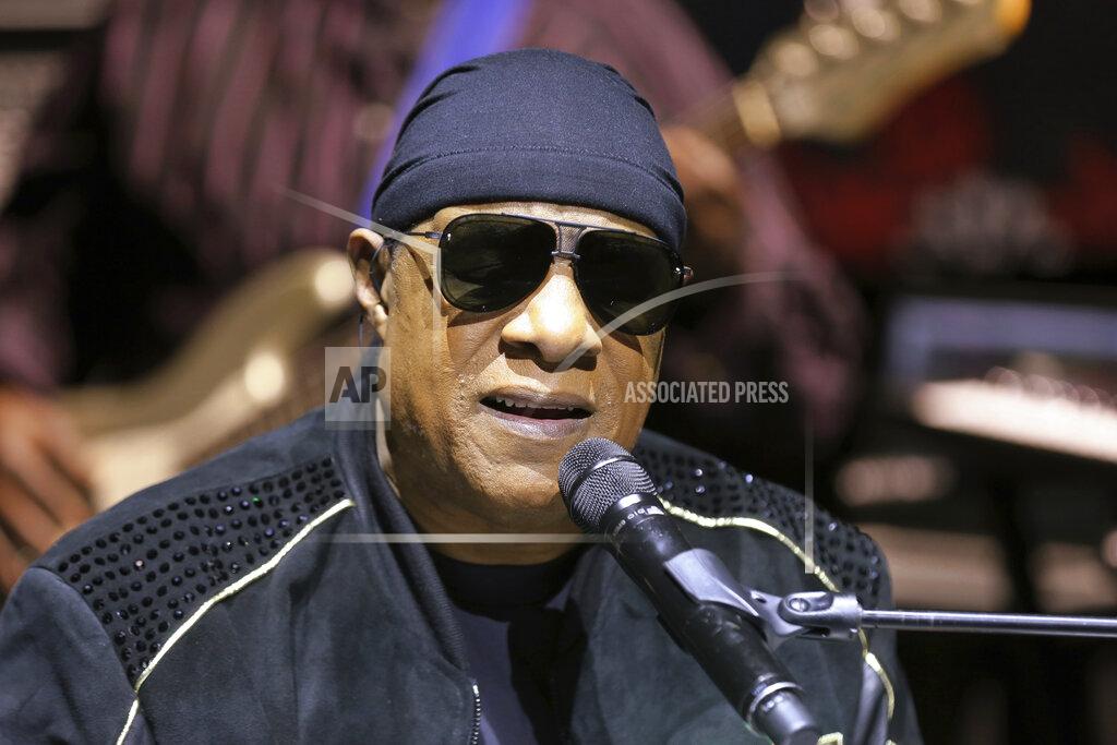Willy Sanjuan FILE - In this Nov. 27, 2018, file photo, Stevie Wonder performs live at a news press conference for the "House Full of Toys 22nd annual Benefit Concert" in Los Angeles. Stevie Wonder is back in his home state of Michigan to get out the vote for Joe Biden, Saturday, Oct. 31, 2020. “The only way we’re gonna win this fight, a fight against injustice, is by voting,” he told a crowd gathered at a drive-in rally in Detroit. (Photo by Willy Sanjuan/Invision/AP, File)