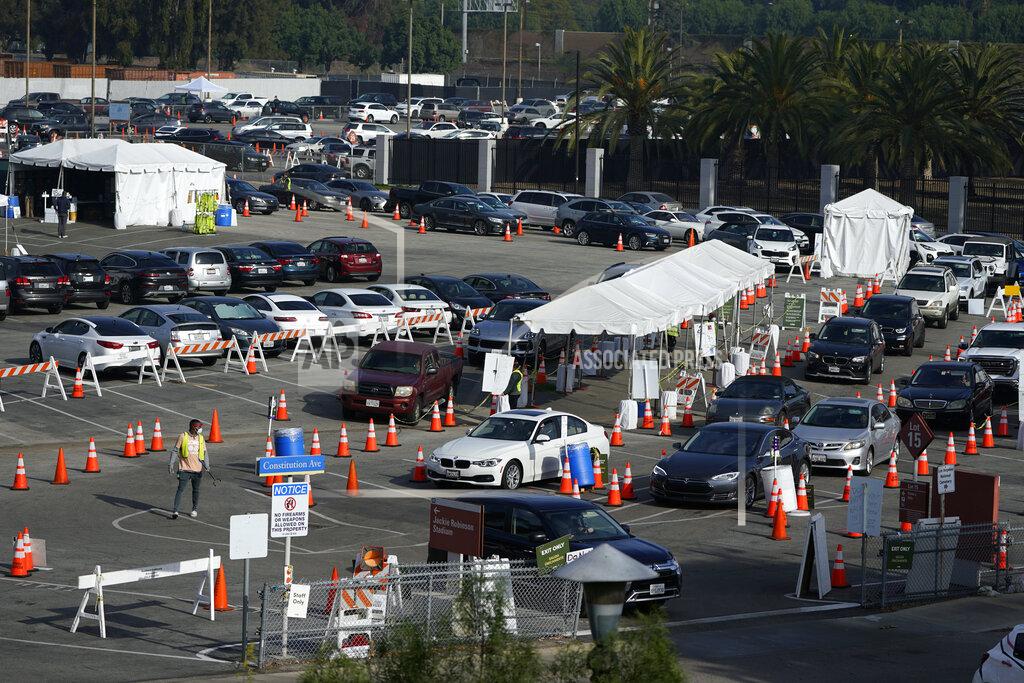 Marcio Jose Sanchez Motorists line up to take a COVID-19 test Tuesday, Jan. 5, 2021, in Los Angeles. (AP Photo/Marcio Jose Sanchez)