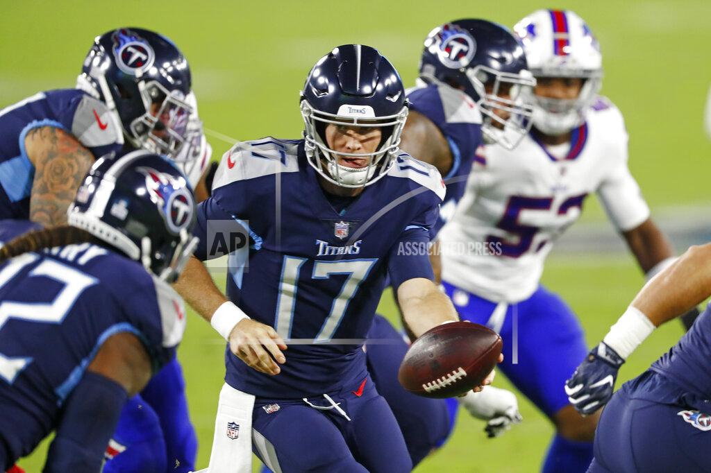 Wade Payne Tennessee Titans quarterback Ryan Tannehill (17) hands the ball off in the first half of an NFL football game against the Buffalo Bills Tuesday, Oct. 13, 2020, in Nashville, Tenn. (AP Photo/Wade Payne)