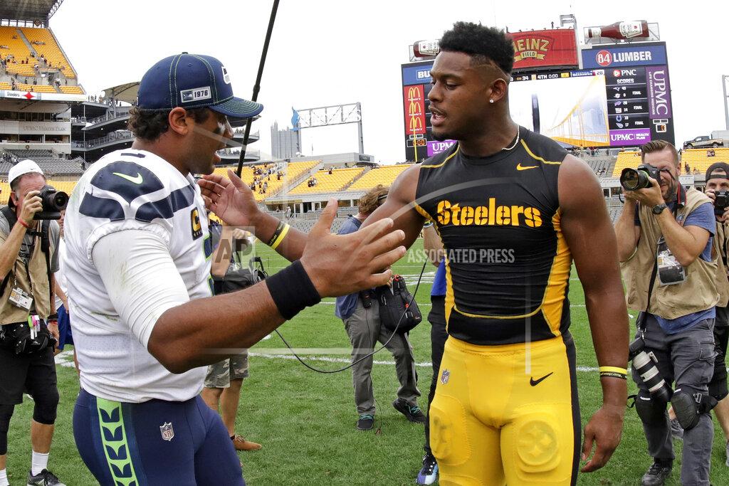 Gene J. Puskar Seattle Seahawks quarterback Russell Wilson, left, greets Pittsburgh Steelers wide receiver JuJu Smith-Schuster after an NFL football game in Pittsburgh, Sunday, Sept. 15, 2019. The Seahawks won 28-26. (AP Photo/Gene J. Puskar)