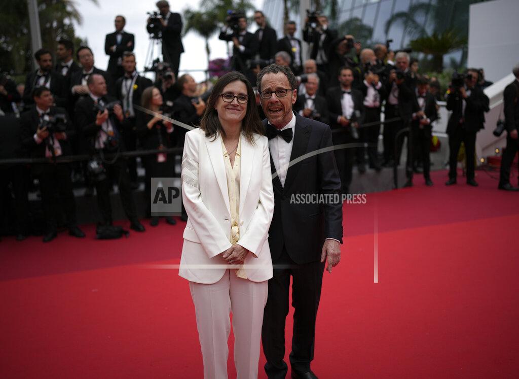 Daniel Cole Tricia Cooke, left, and Ethan Coen pose for photographers upon arrival at the premiere of the film 'Forever Young' at the 75th international film festival, Cannes, southern France, Sunday, May 22, 2022. (AP Photo/Daniel Cole)