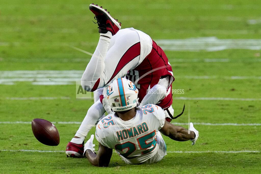 Ross D. Franklin Miami Dolphins cornerback Xavien Howard (25) breaks up a pass intended for Arizona Cardinals wide receiver DeAndre Hopkins during the second half of an NFL football game, Sunday, Nov. 8, 2020, in Glendale, Ariz. (AP Photo/Ross D. Franklin)