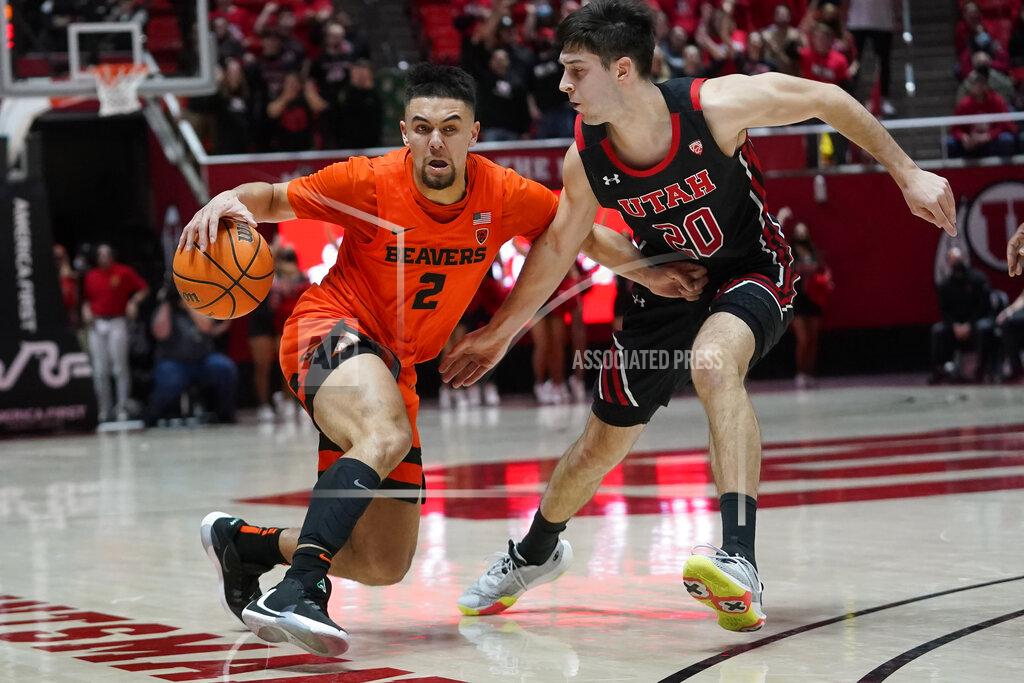 Rick Bowmer Utah guard Lazar Stefanovic (20) guards against Oregon State guard Jarod Lucas (2) in the first half during an NCAA college basketball game Thursday, Feb. 3, 2022, in Salt Lake City. (AP Photo/Rick Bowmer)