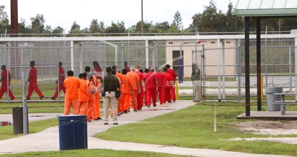 José A. Iglesias This Nov. 6, 2020 photo shows detainees inside Krome Detention Center in Miami, Fla. Under the Trump administration, the country has become increasingly inhospitable for undocumented immigrants and those seeking asylum. But it has also recalibrated the treatment of legal permanent residents — referred to as “green card” holders — and naturalized citizens, affording zero tolerance for transgressions that would have been of little interest under previous administrations. (José A. Iglesias/Miami Herald via AP)