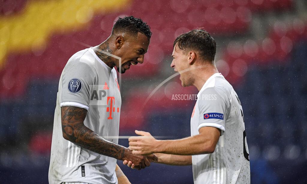 Andreas Schaad Bayern's Jerome Boateng, left, celebrates with Bayern's Joshua Kimmich, right, after he scored his side's third goal during the Champions League group A soccer match between RB Salzburg and Bayern Munich in Salzburg, Austria, Tuesday, Nov. 3, 2020. (AP Photo/Andreas Schaad)