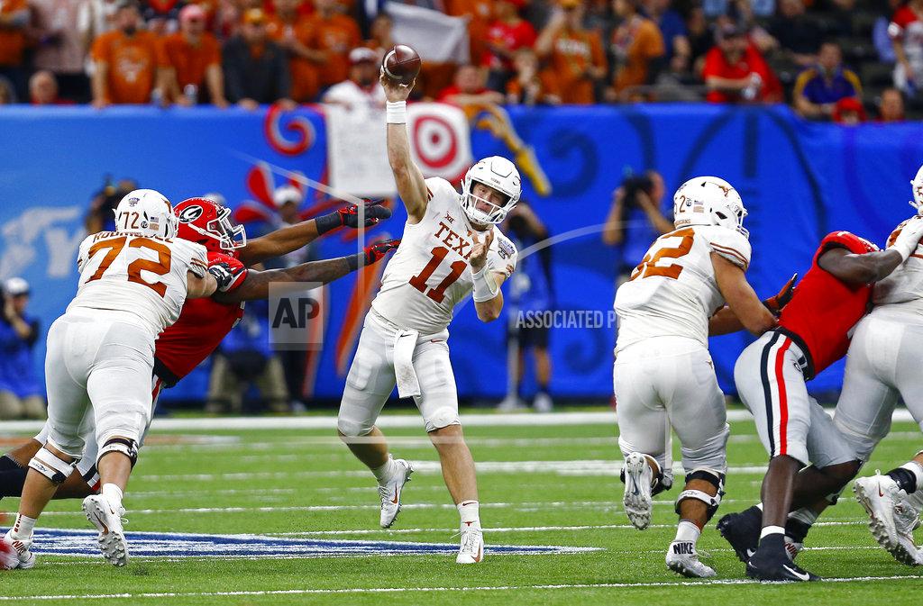 Butch Dill Texas quarterback Sam Ehlinger (11) throws a pass during the second half against Georgia in the Sugar Bowl NCAA college football game Tuesday, Jan. 1, 2019, in New Orleans. (AP Photo/Butch Dill)
